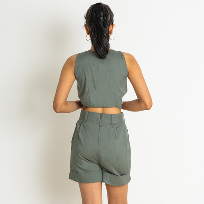 Short cropped waistcoat in a linen and viscose blend weave with a V-neck, single button closing, paired with same color classic bermuda shorts set with both side pockets and breathable fabric.