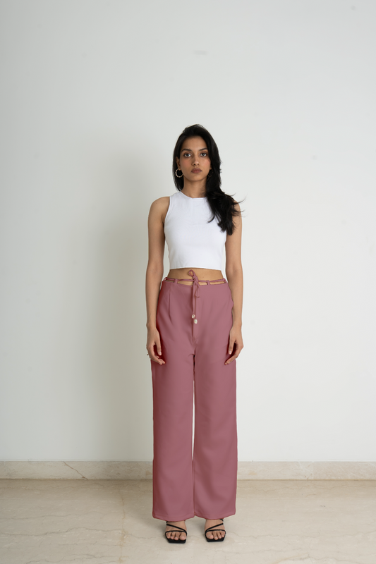 Wide legged trousers in knitted fabric. High waist with a zip fly and a concealed button and hook-and-eye fastener in a calming pink shade. Diagonal side pockets, and wide, straight legs with drawstrings attached to the belt for added comfort.