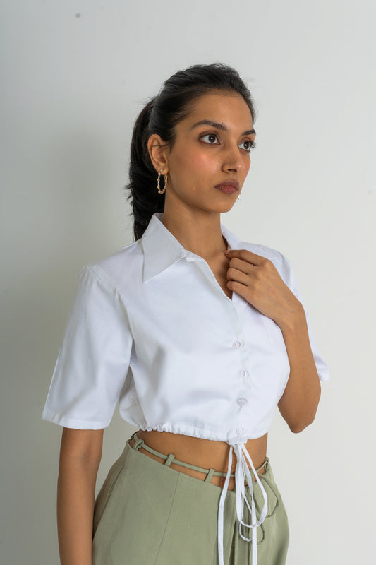 Made from crisp cotton poplin, Ferlyy’s white crop button-down shirt features a front pocket and a drawstring to cinch the cropped hem. 100% Cotton