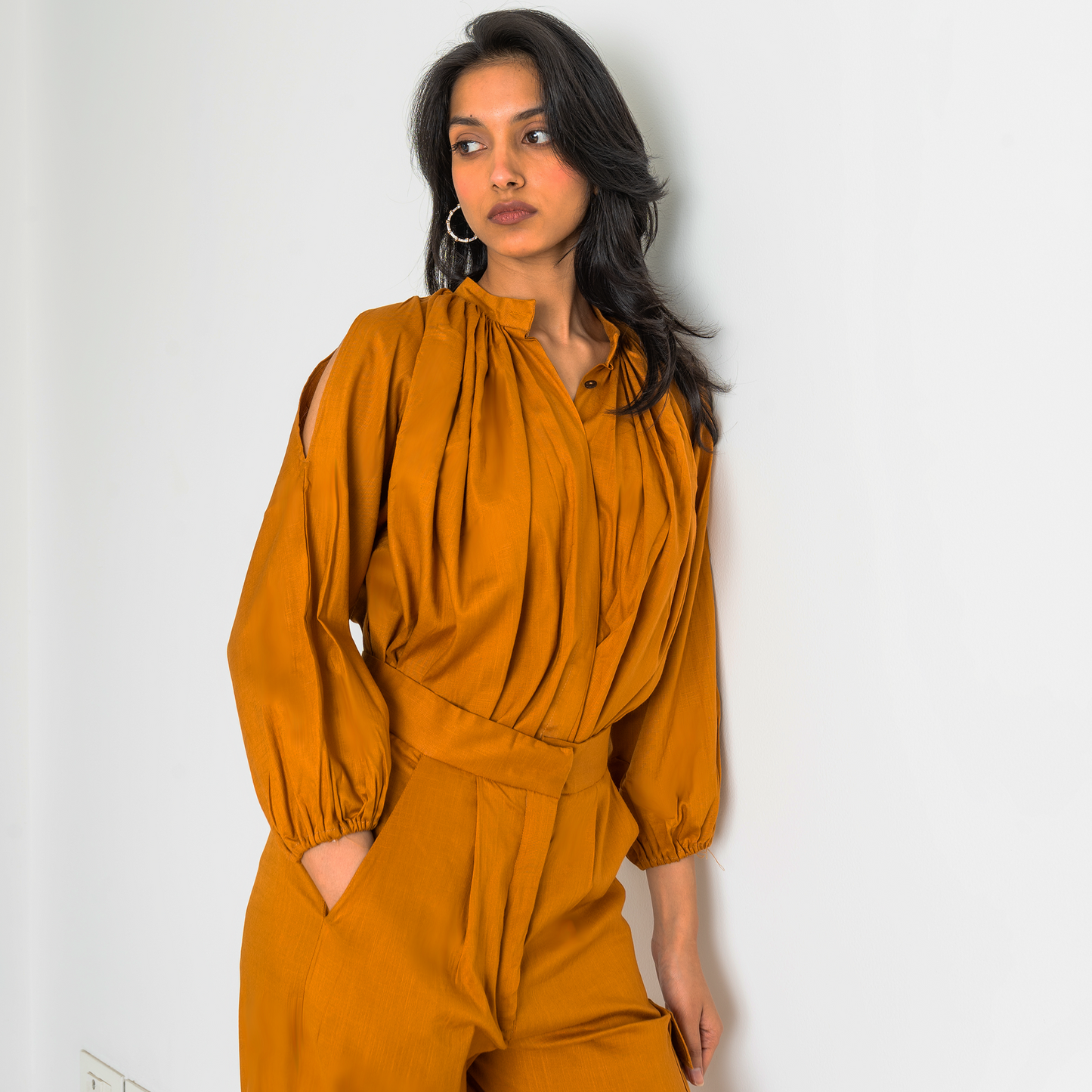 Cold-shoulder long shirt with pleats and gathers on both sides, paired with matching mustard colour multi-pocketed cargo pants for summer. Unlined.