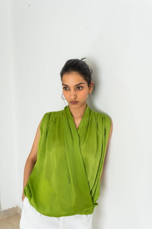 Ferlyy’s Cowl V-neck satin top in green exudes elegance and charm. Whether for a casual outing or a special occasion, this sleeveless top is the ultimate choice for everyday fashion. Elevate your style and make a statement with our creatively designed street chic top.