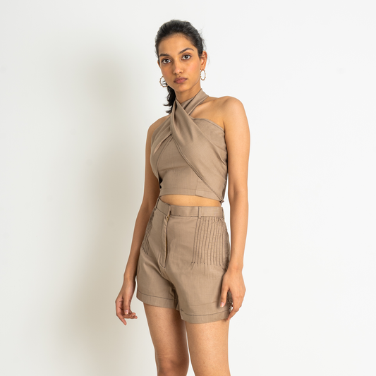 Criss cross, back tie-detail halter neck cropped top paired with fold pleated shorts set in a mocha shade.